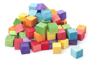 heap of colorful wooden kids building blocks